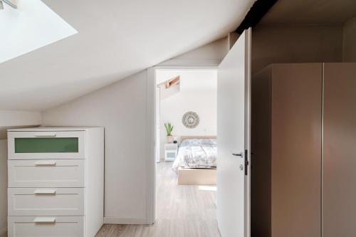 a bedroom with a white closet and a bed at Casa di Diego in Como