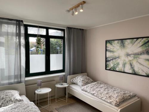 Postel nebo postele na pokoji v ubytování Ferien- und Messewohnung in Meerbusch