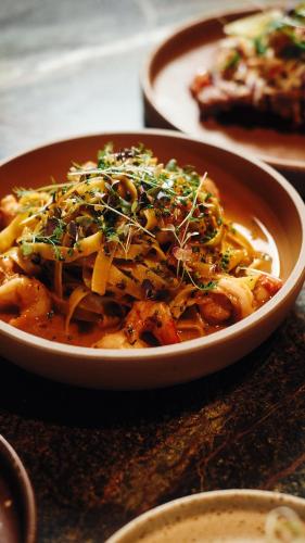 a bowl of food sitting on a table at Else Kuala Lumpur, a member of Design Hotels in Kuala Lumpur