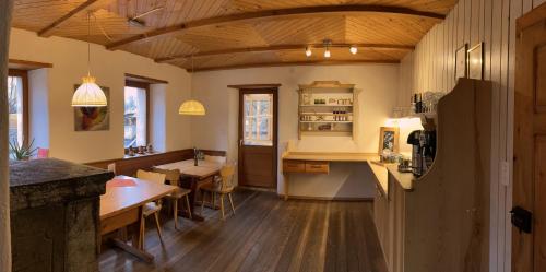 a kitchen and dining room with a table and chairs at Centro Arte Cabbiolo in Cabbiolo