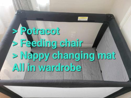 a sign that saysrotost feeding chart happy changing mat all in wandride at Sky tower just next DOOR FREE parking in Auckland