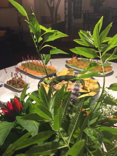 a table with several plates of food on it at CASA LIBERTINI in Grammichele