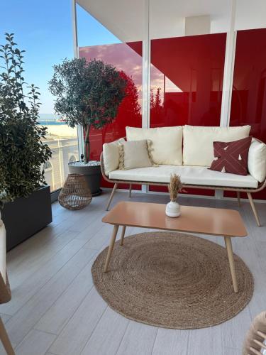 a living room with a couch and a coffee table at Azuma Luxury Home in Bari