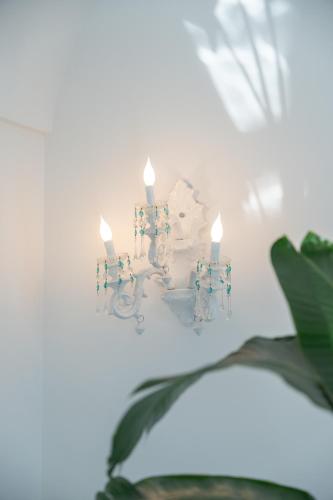a candle holder with two candles on top of it at Villa Navarra in Praiano