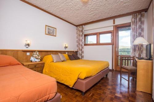 Postel nebo postele na pokoji v ubytování Hotel Tre Cime Terminillo
