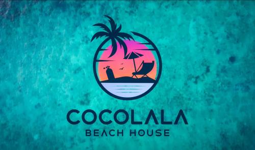 een logo voor een strandhuis met een palmboom bij Cocolala Beach House in Nungwi