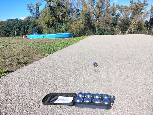 a tray of blue balls sitting on the ground at Glamping Pogorzany - Jurty in Zabierzów