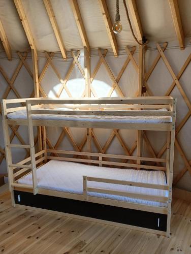 a couple of bunk beds in a room at Glamping Pogorzany - Jurty in Zabierzów