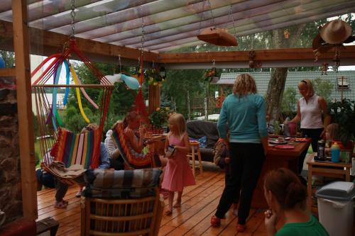 a group of people standing in a living room at Sodyba Brazylija in Taraldžiai