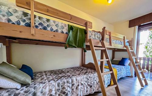 a bedroom with two bunk beds and a ladder at Asiago Plateau New Modern House in Asiago