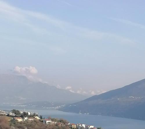a view of a body of water with mountains in the background at House Leana Herceg Novi in Herceg-Novi
