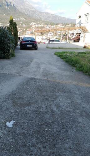 a car parked in the driveway of a house at House Leana Herceg Novi in Herceg-Novi