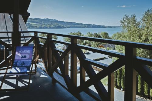 a balcony with a view of the water at Kompleks Tawerna Vito - Apartamenty Vito in Czorsztyn
