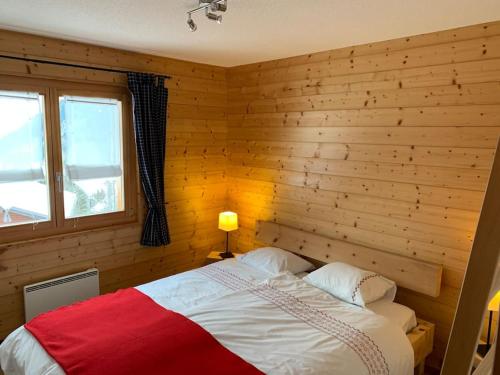 En eller flere senge i et værelse på Chalet Rio - Ovronnaz - Swiss Alps