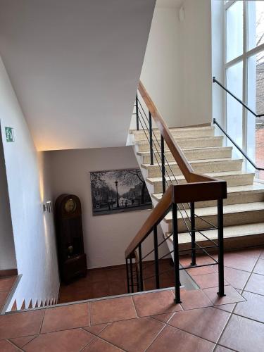 a staircase in a building with a stair case at Hotel Wittgensteiner Hof in Bad Laasphe