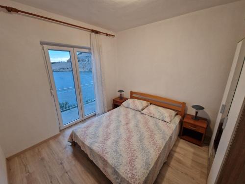 Ένα ή περισσότερα κρεβάτια σε δωμάτιο στο Apartment Lisarica