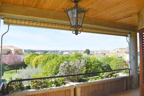 a balcony with a view of a garden at Casa Gilgar Olite in Olite