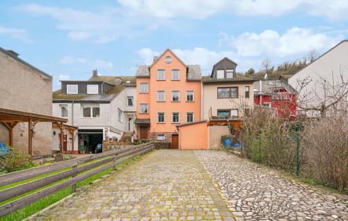 a cobblestone street in a town with houses at 1 Bedroom Cozy Apartment In Pommern in Pommern