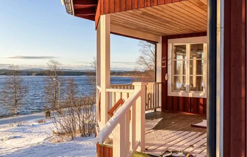 a porch of a house with a view of the water at Nice Home In Hunge With House Sea View in Bräcke
