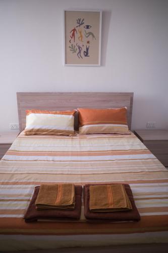 a large bed with two trays on top of it at Cova da Iria 5 in Tal-Pietà