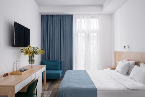 Ένα ή περισσότερα κρεβάτια σε δωμάτιο στο Mariinsky Boutique Hotel