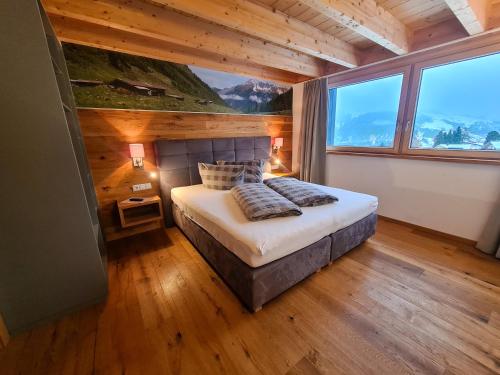 Postel nebo postele na pokoji v ubytování Alpenzeit