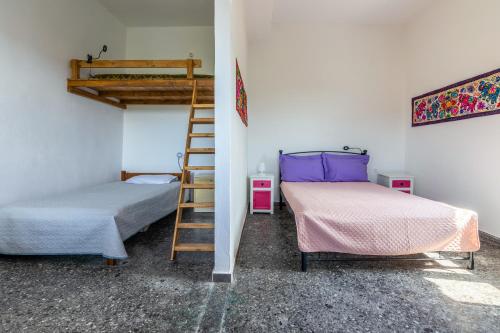 Ένα ή περισσότερα κρεβάτια σε δωμάτιο στο La Maison Bleue