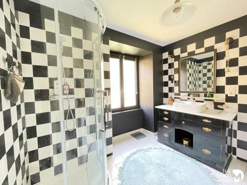 a bathroom with a sink and a shower at Au moulin de Pascaline 