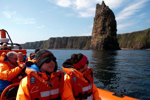 a group of people on a boat in the water at Caithness View Luxury Farm Lodges and BBQ Huts in Wick
