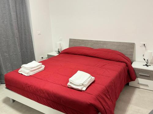 Postel nebo postele na pokoji v ubytování Affittacamere “In Piazzetta”