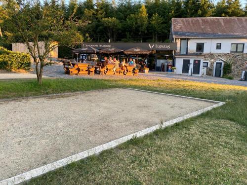 a group of tables and benches in a park at DeerN'Wood in Trois-Ponts