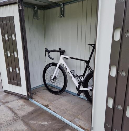 a bike is parked in a garage at Vakantiehuis ontdek Zuid - Limburg in Simpelveld
