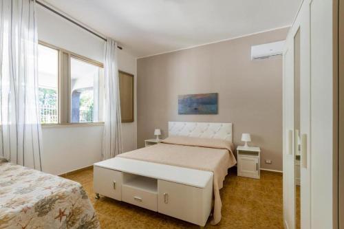 Postel nebo postele na pokoji v ubytování Casa vacanze Tafuro