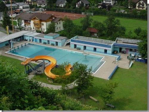 an aerial view of a swimming pool with a slide at Ferien am Bischofsberg - Edlbach 31 in Windischgarsten