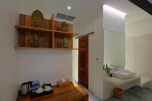 a bathroom with a sink and a toilet and a counter at Apsara Residence Hotel in Siem Reap