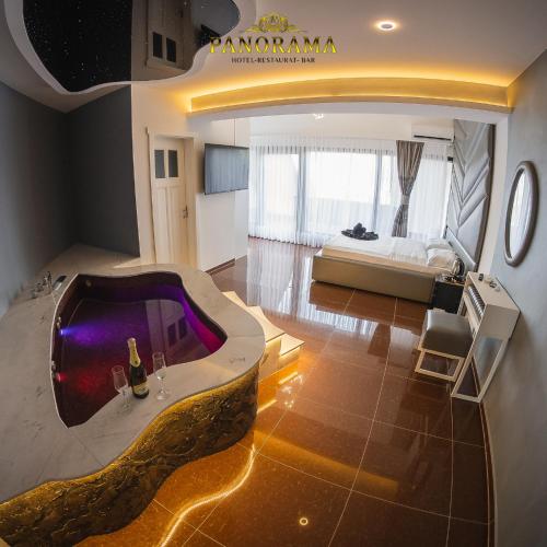 a hotel room with a tub in the middle of a room at Hotel Panorama in Gjakove