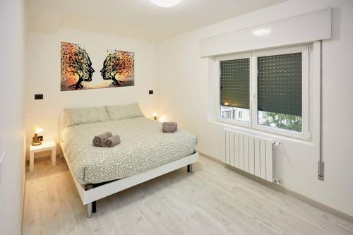 Postel nebo postele na pokoji v ubytování Modern flat per 6 Aviano AC Parking