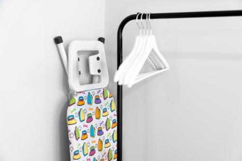a phone holder with colorful shoes on it at Modern 2 Bedroom Apartment - Off-street Parking - Top Rated - 1aS in Amblecote