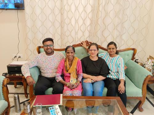 a group of people sitting on a couch at Gupta Vilas - A Boutique Homestay in Agra
