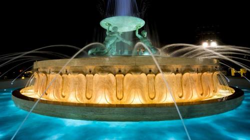 a water fountain with a frog on top of it at Charming Maltese Townhouse in Senglea in Senglea