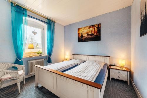 Postel nebo postele na pokoji v ubytování Altes Forsthaus Königskrug