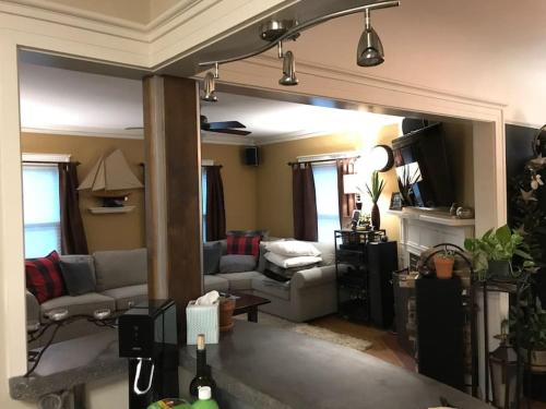 a living room with a couch and a table at Beautiful Luxury Suite A of Shorewood Home in Shorewood