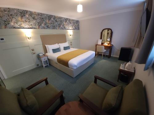Ένα ή περισσότερα κρεβάτια σε δωμάτιο στο Stanton House Hotel