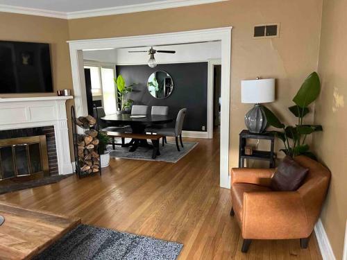 a living room with a table and a chair at Beautiful Luxury Suite B of Shorewood Home in Shorewood