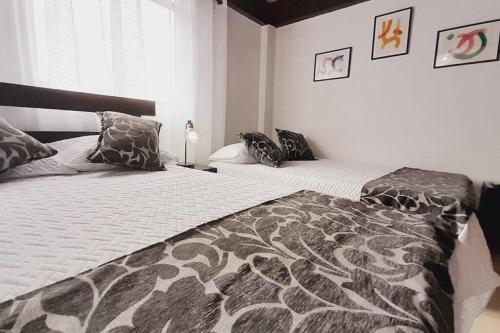 Cama o camas de una habitación en Apartamento Turístico En Calarcá Quindío