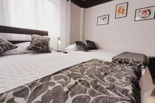 Postel nebo postele na pokoji v ubytování Apartamento Turístico En Calarcá Quindío a 10 min de Armenia