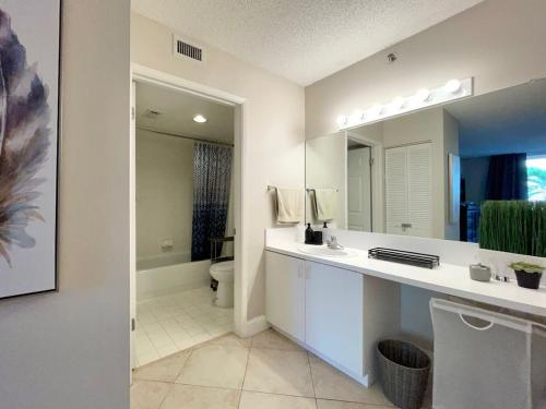 a bathroom with a sink and a toilet and a mirror at 26-2A New Studio prime 20's W D newly furnished in New York