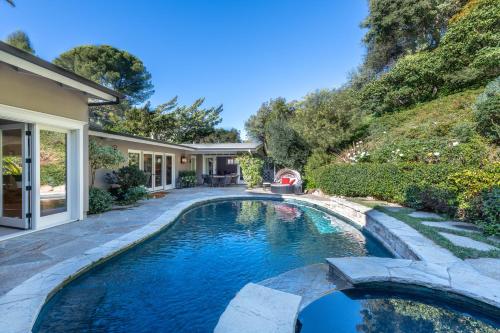 a swimming pool in the backyard of a house at Luxury Beverly Hills Suite in Beverly Hills
