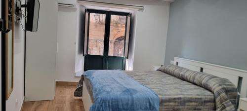Cama o camas de una habitación en Le Antiche Porte