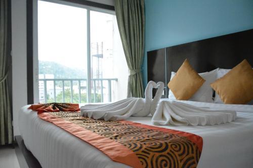 Zephyr Grand Hotelにあるベッド